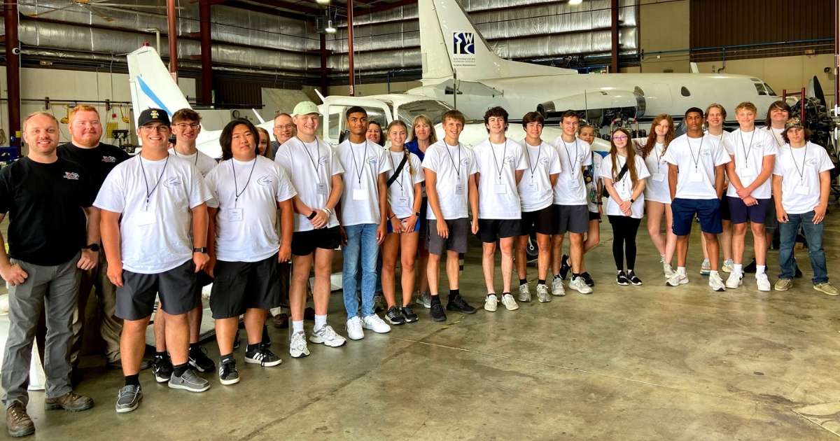 Southwestern Illinois College students at an aircraft hanger