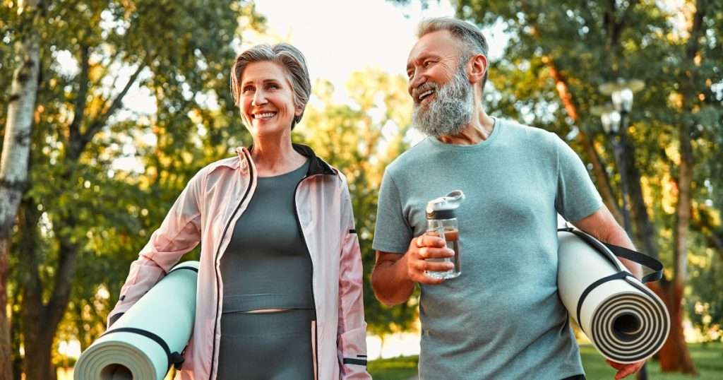 Happy senior couple enjoying the outdoors in Central Illinois. Central Illinois senior moving services provide expert assistance to make transitioning to new homes seamless and stress-free.