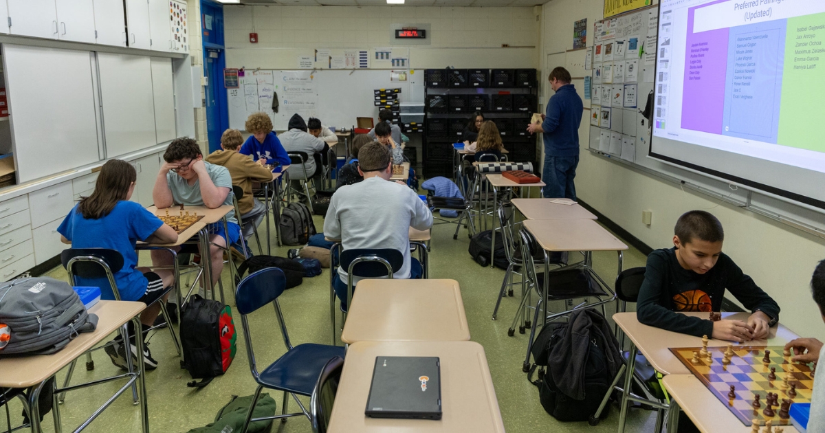 Students in a classroom playing chess at Elmhurst School District